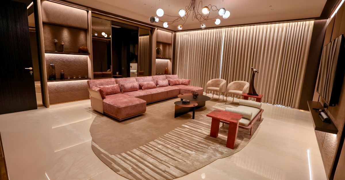 Living area featuring a custom neutral rug with Diviso sofa and Marmo dining table from Wriver, modern luxury interiors in Ahmedabad